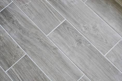 gray wood look ceramic tiles with white grout 1