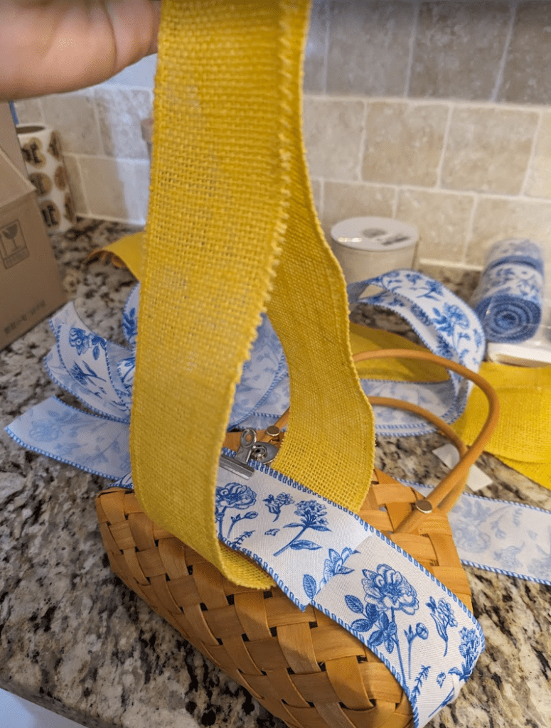 Making-the-Yellow-bow-around-ribbon-and-basket-to-secure-ribbon-in-place engagement party favors