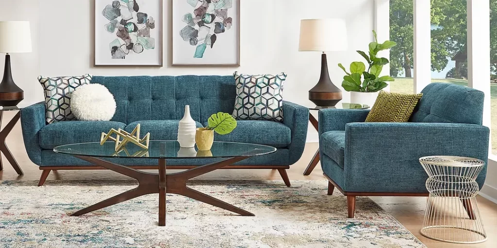 Rooms To Go East Side Sofa with attached footrest in Blue